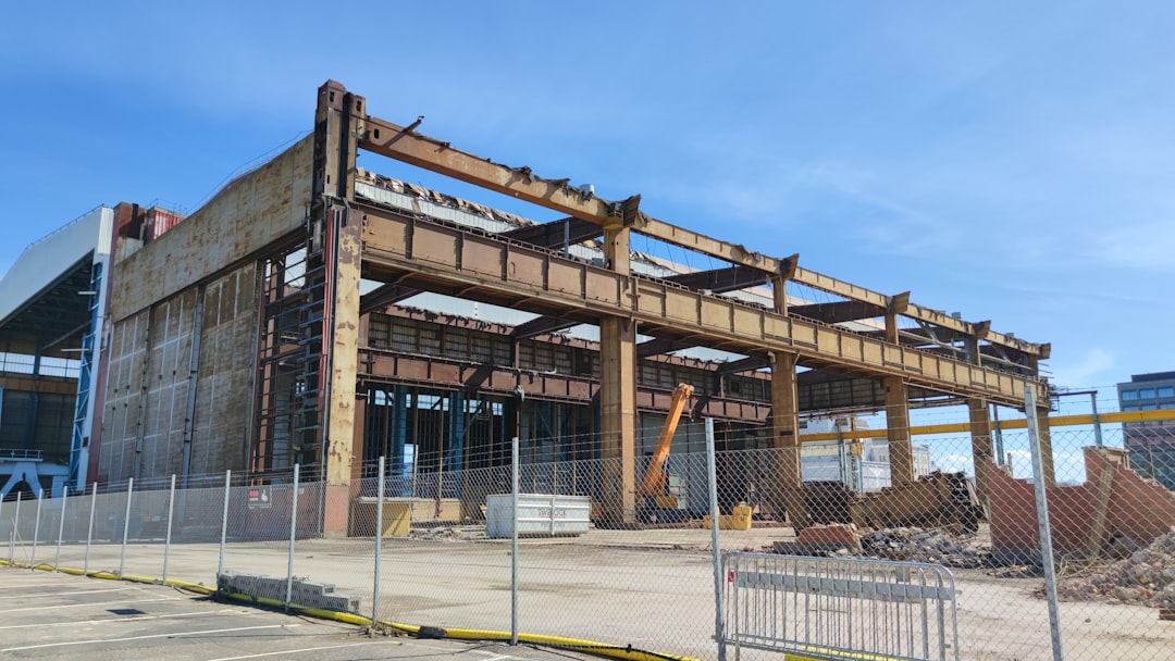 a building under construction with a fence around it