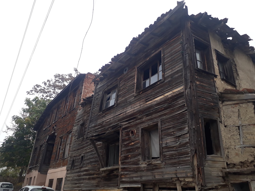 an old run down building with broken windows